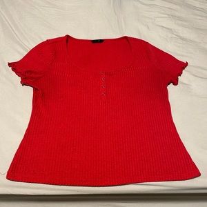 SHIRN brand shirt. Red short sleeve with lettuce trim and buttoned in front.